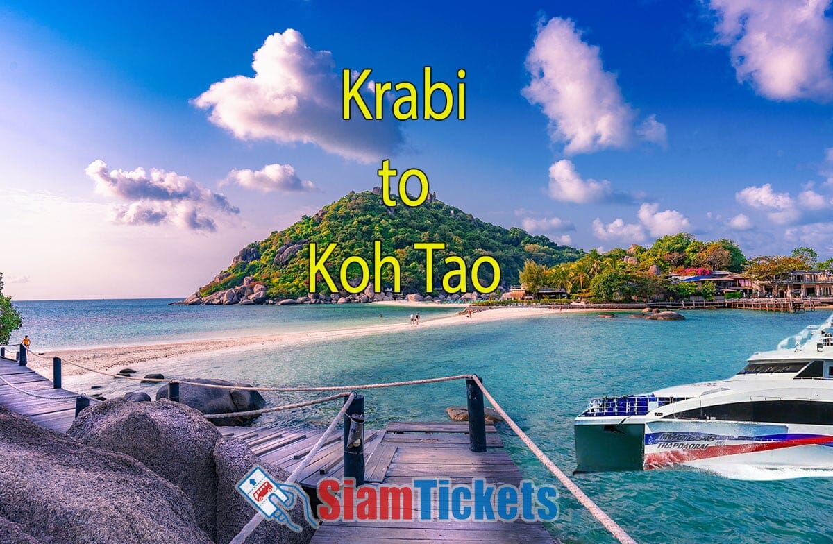 Scenic view of a wooden bridge leading to Koh Nang Yuan island near Koh Tao, with crystal-clear waters and lush greenery under a blue sky with fluffy clouds.